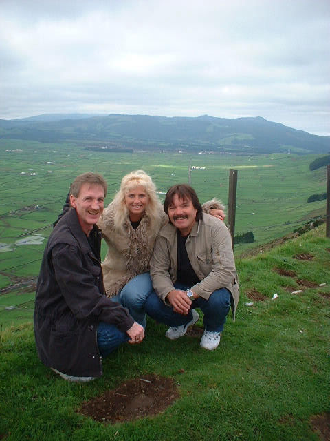 Rodney Kelley, Donna Moore, Rick Moore posing in a green field on the island of Azores, Portugal beautiful photo!