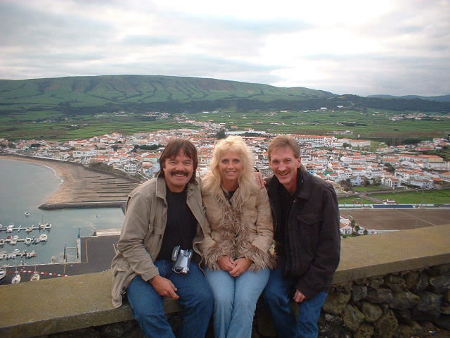 Rick Moore, Donna and Magician Rodney Kelley in Portugal with view of city in background