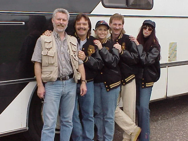 Rodney Kelley, Rick Moore, Rudiger Widdrat and Donna Moore standing in from of the touring bus