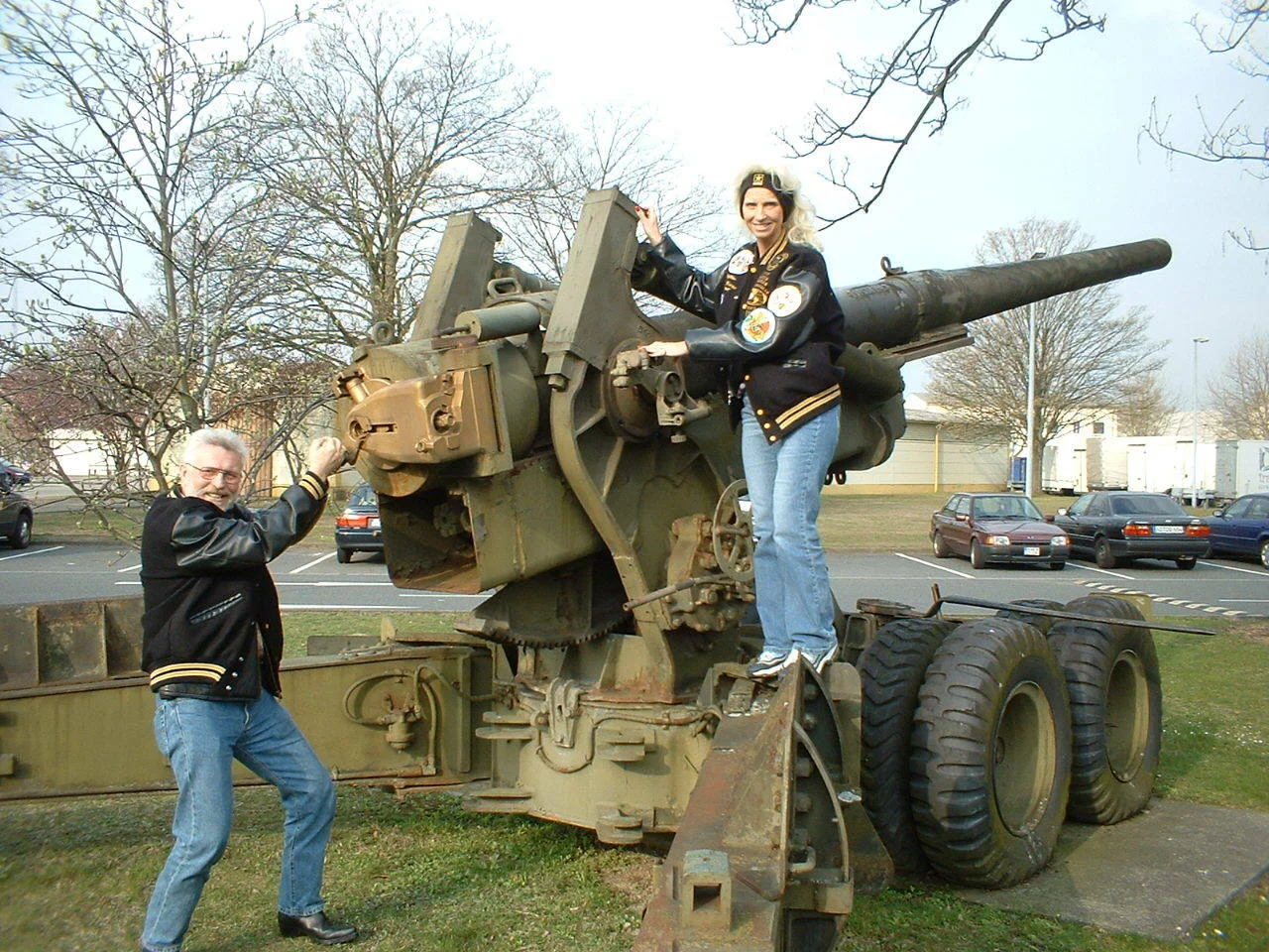Road Rage Rudy and Donna Moore posing on a tank at a military base in Germany