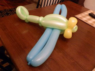 green airplane balloon animal