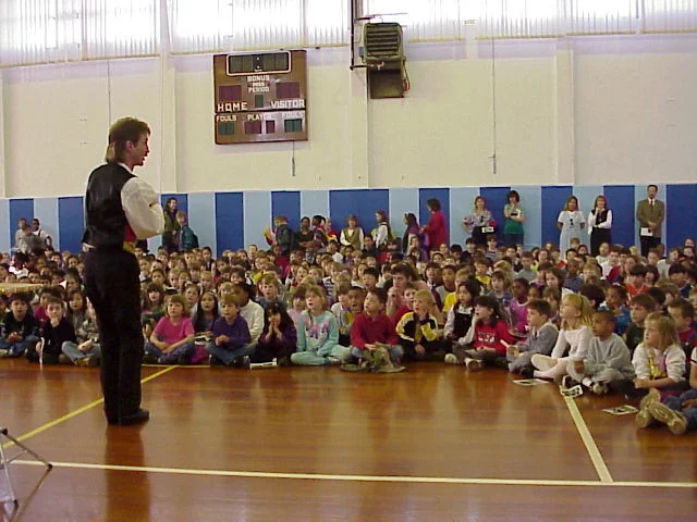 Magician Rodney Kelley performing magic show in Aviano Italy at a school