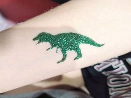 green dinosaur glitter tattoo