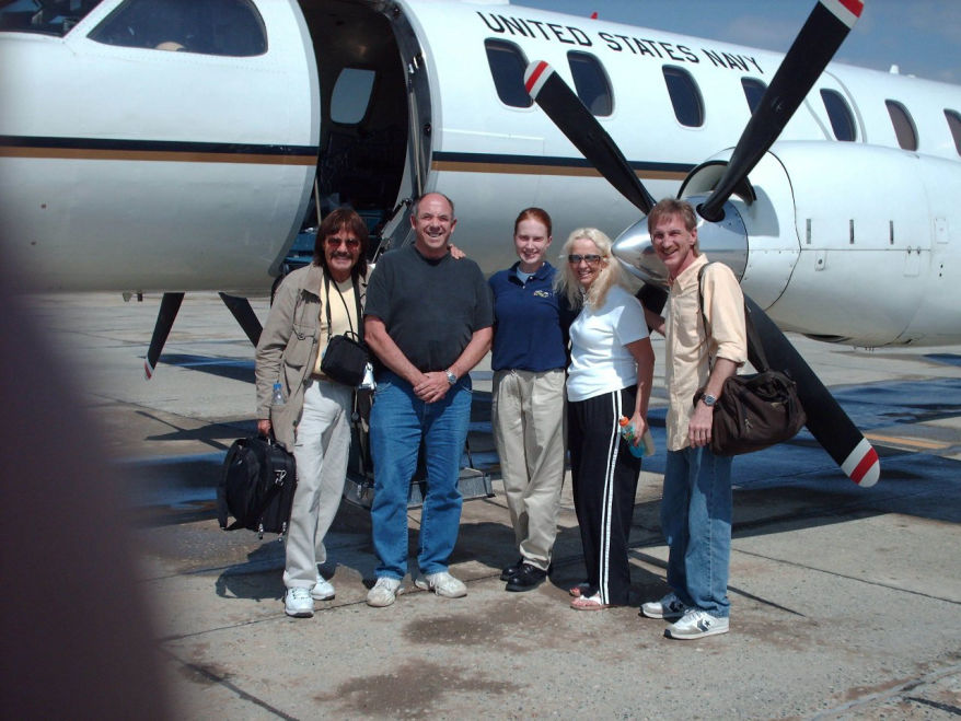 Navy plane with pilot and Rick Moore, Donna Moore & Rodney Kelley after flight to Crete