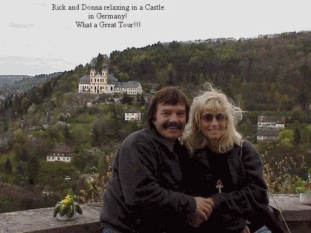 Rick and Donna Moore posing in front of castle in Germany