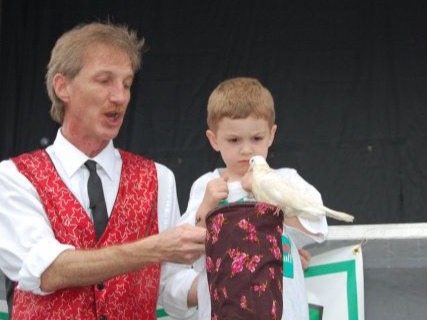 child touching the magical bird that just appeared