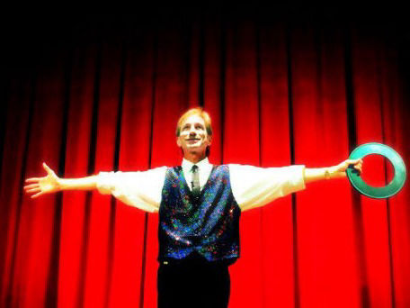 Magician Rodney Kelley holding color changing rings