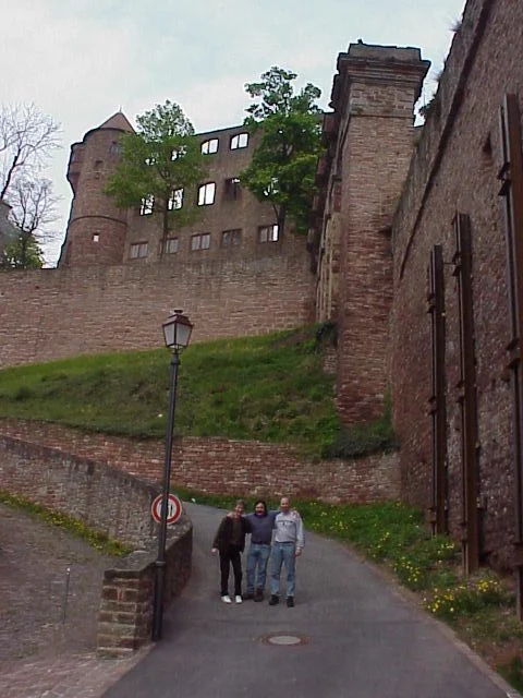 Magician Rodney Kelley, Magician Rick Moore, Ventriloquist David Turner standing in front of a large castle in Germany
